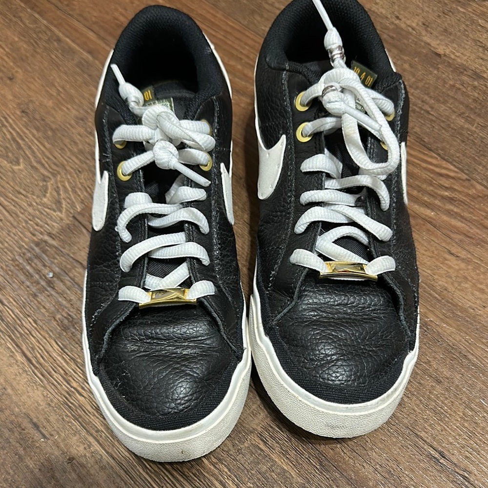 Black and White Sneakers with Gold Accents